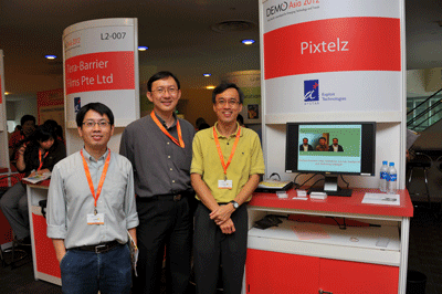 From left, ADSC researcher and Pixtelz co-founder Jiangbo Lu, ADSC Deputy Director Jeremy Heng, and Pixtelz co-founder Boon Leng Lee staffed Pixtelz's CuteChat booth at the 2012 DEMO Asia conference